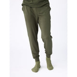 Green jogger pants and socks on a white background