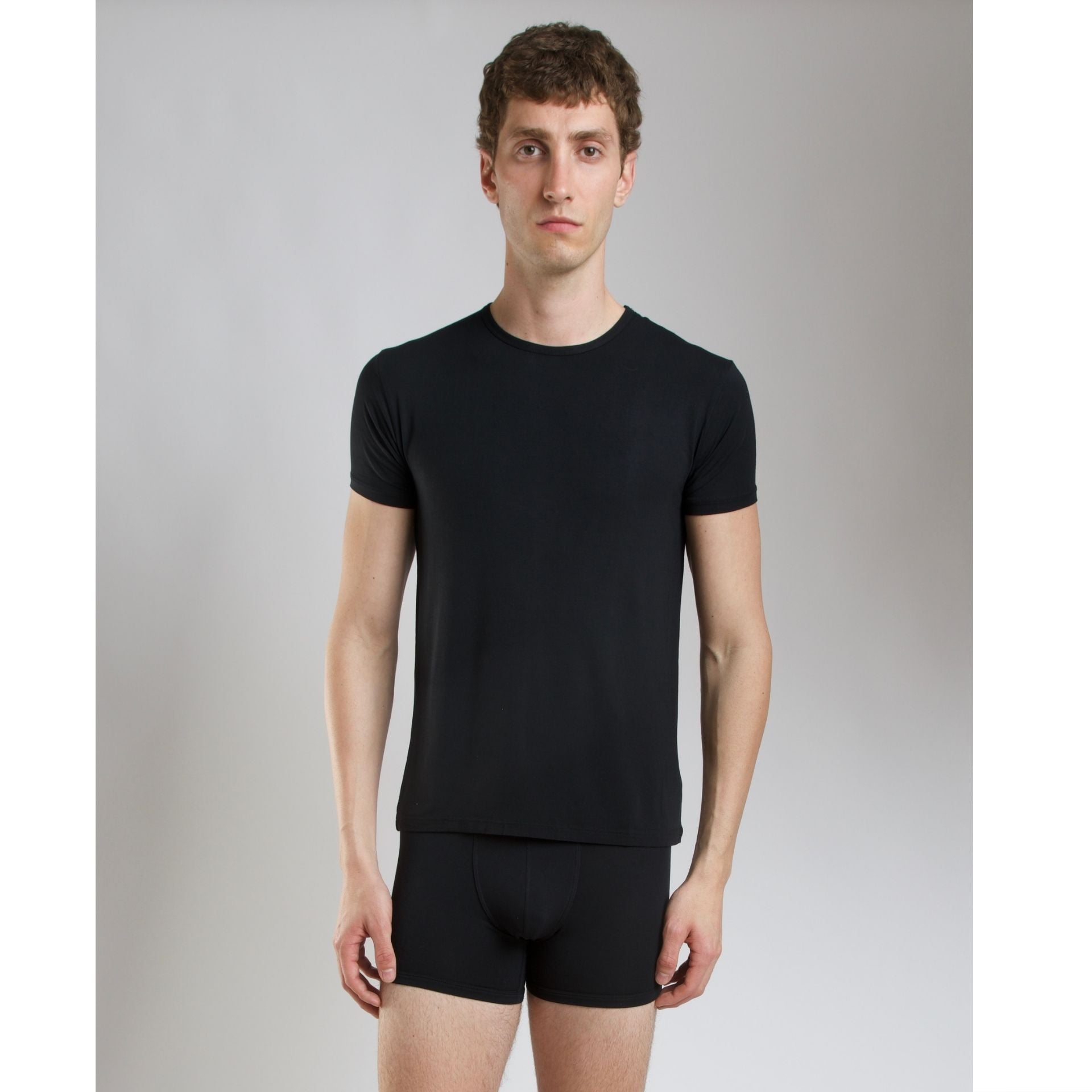 Flat lay of SilkCut Micro Modal Air unisex t-shirt in black and navy showcasing breathable softness