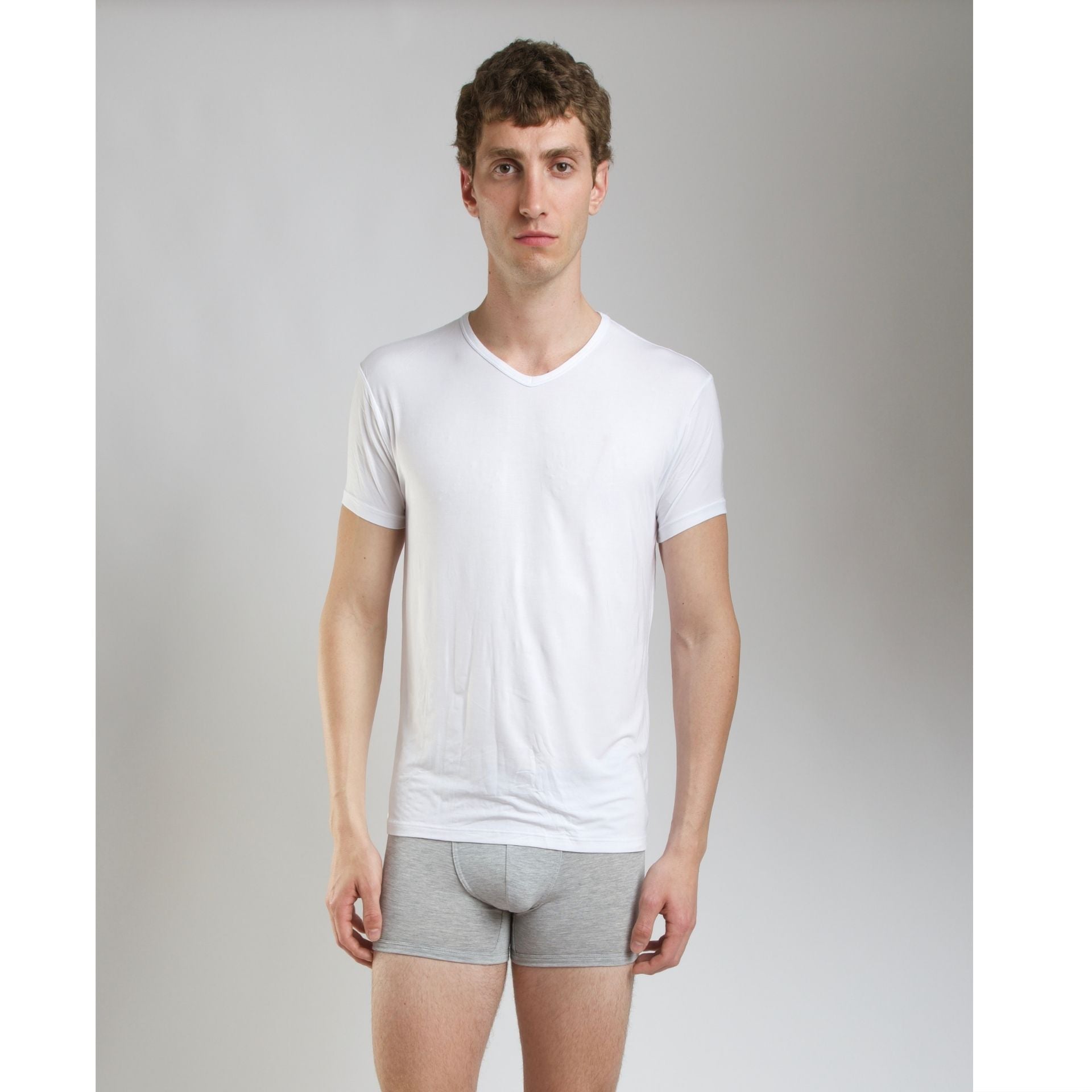 Side view of model wearing SilkCut Micro Modal Air v-neck undershirt demonstrating slim tailored fit