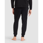 Person wearing black sweatpants on a light gray background