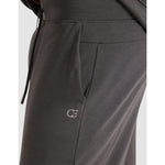 Dark gray sweatpants with a logo on a light gray background