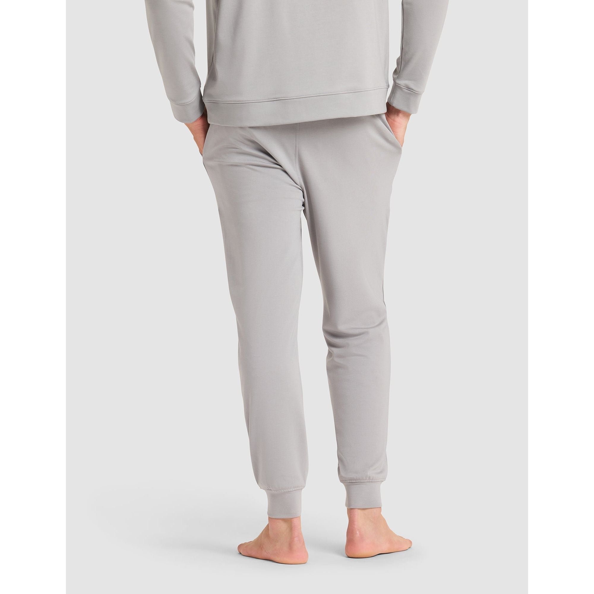 Gray sweatshirt and pants set on a white background
