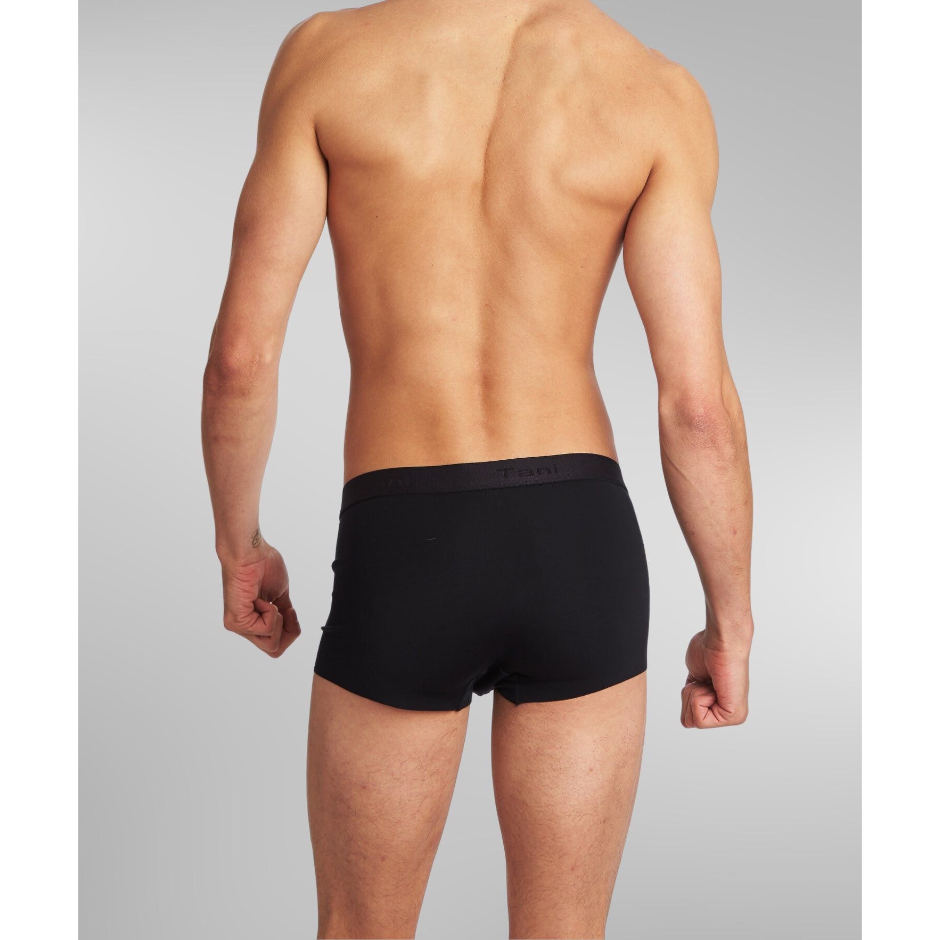Man relaxing at home wearing SilkCut Sea Island Cotton Trunks – effortless everyday comfort