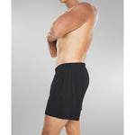 Side view of model wearing black silk boxer shorts