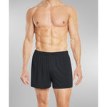 Model wearing black silk boxer shorts front view