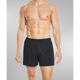 Model wearing black silk boxer shorts front view