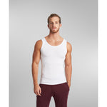 Model layering SilkCut tank under dress shirt for everyday comfort