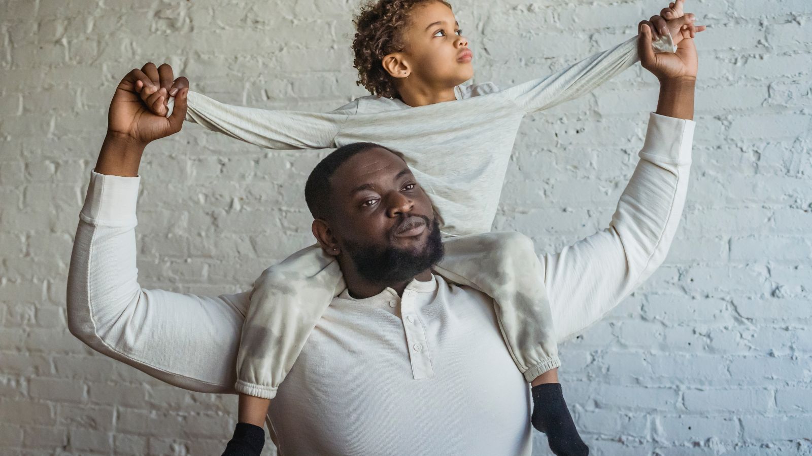 Father smiling while opening a SilkCut boxer brief gift box on a sunny morning.