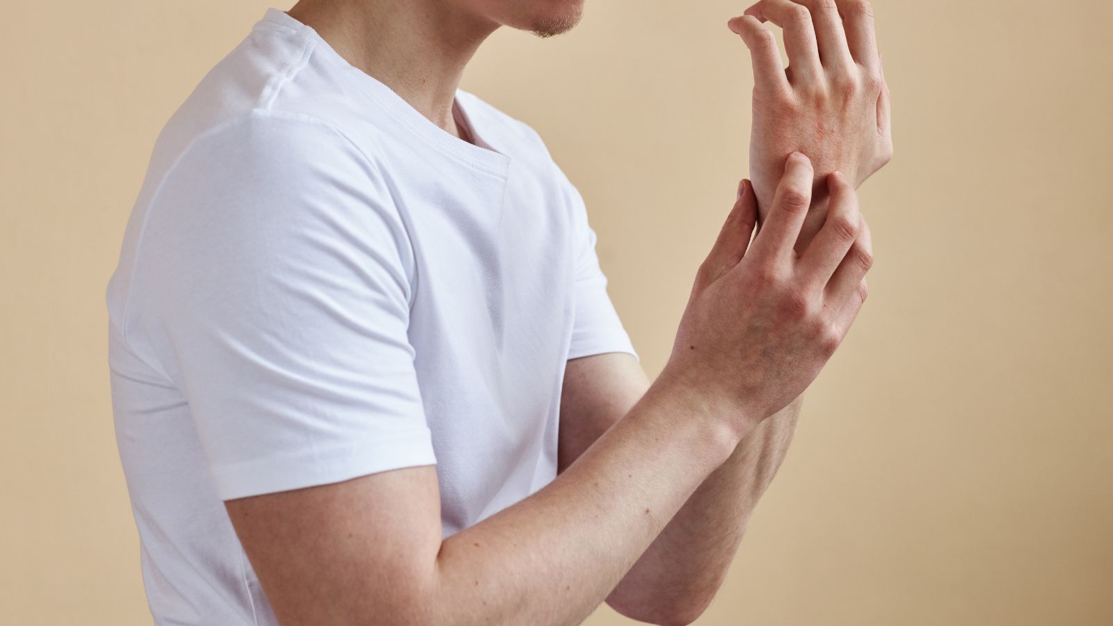 Man sitting comfortably in soft, eczema-safe boxer briefs with natural morning light