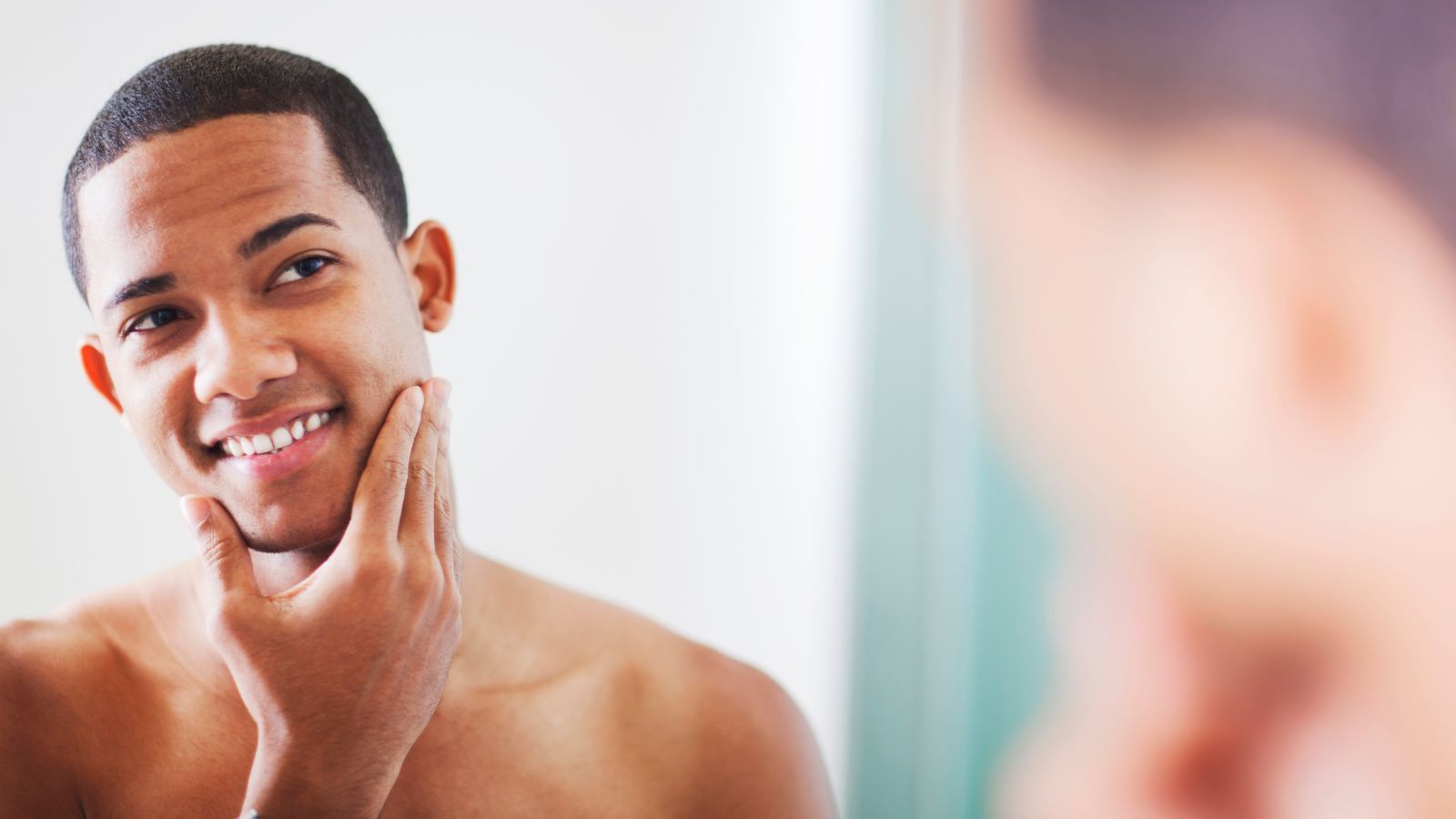 Happy Man looking in the mirror wearing SilkCut quality men’s underwear guide showing premium breathable everyday essentials