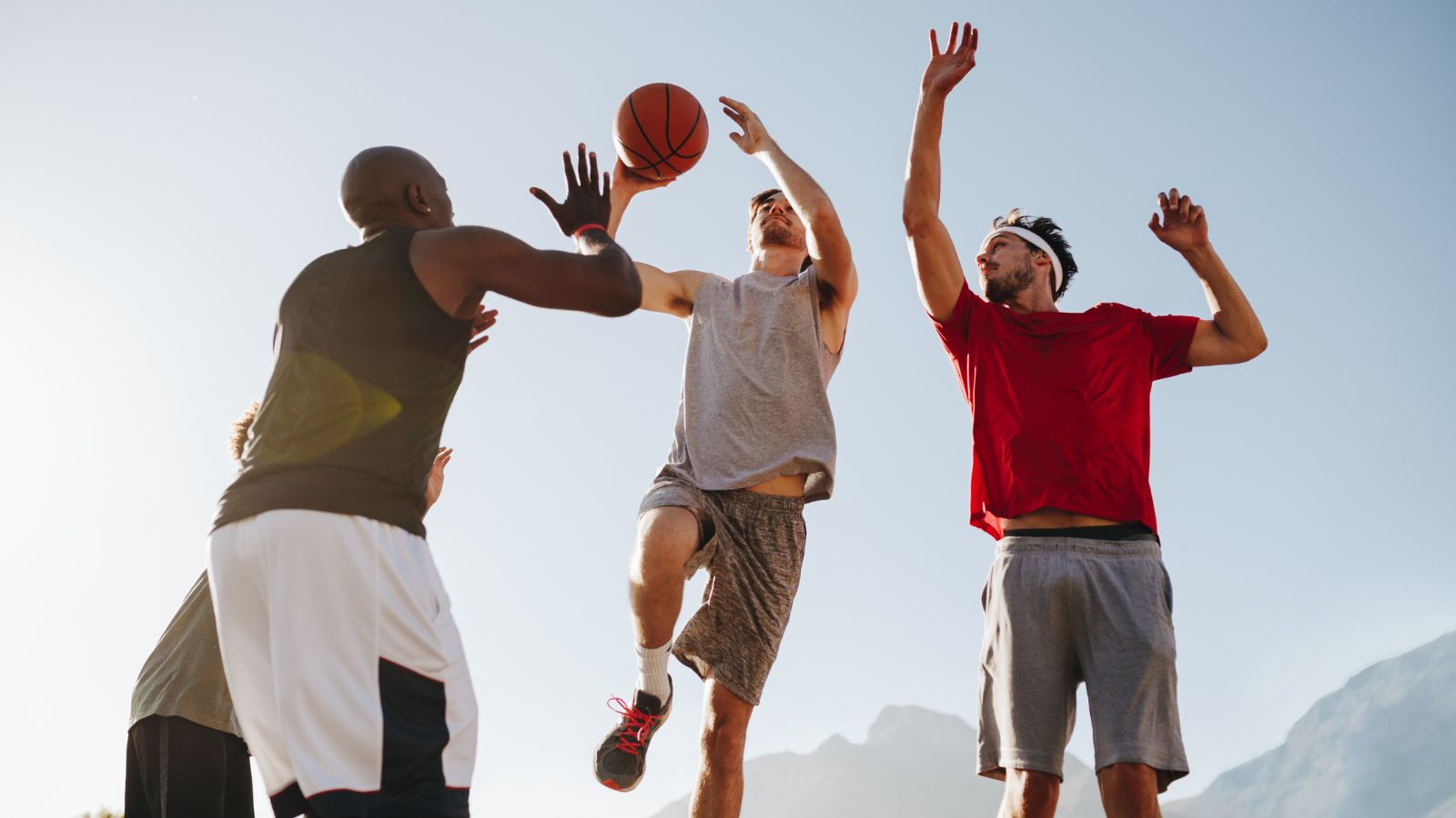 men in different types of underwear playing busketball