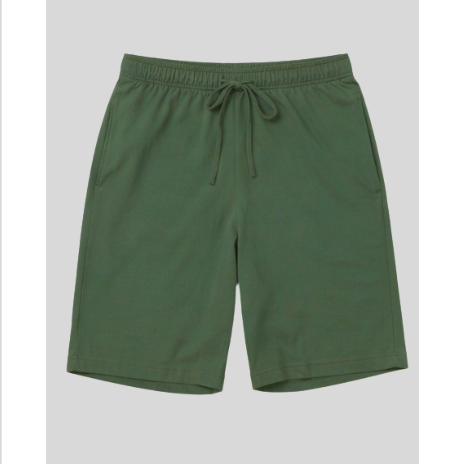 Green shorts with a drawstring on a light gray background