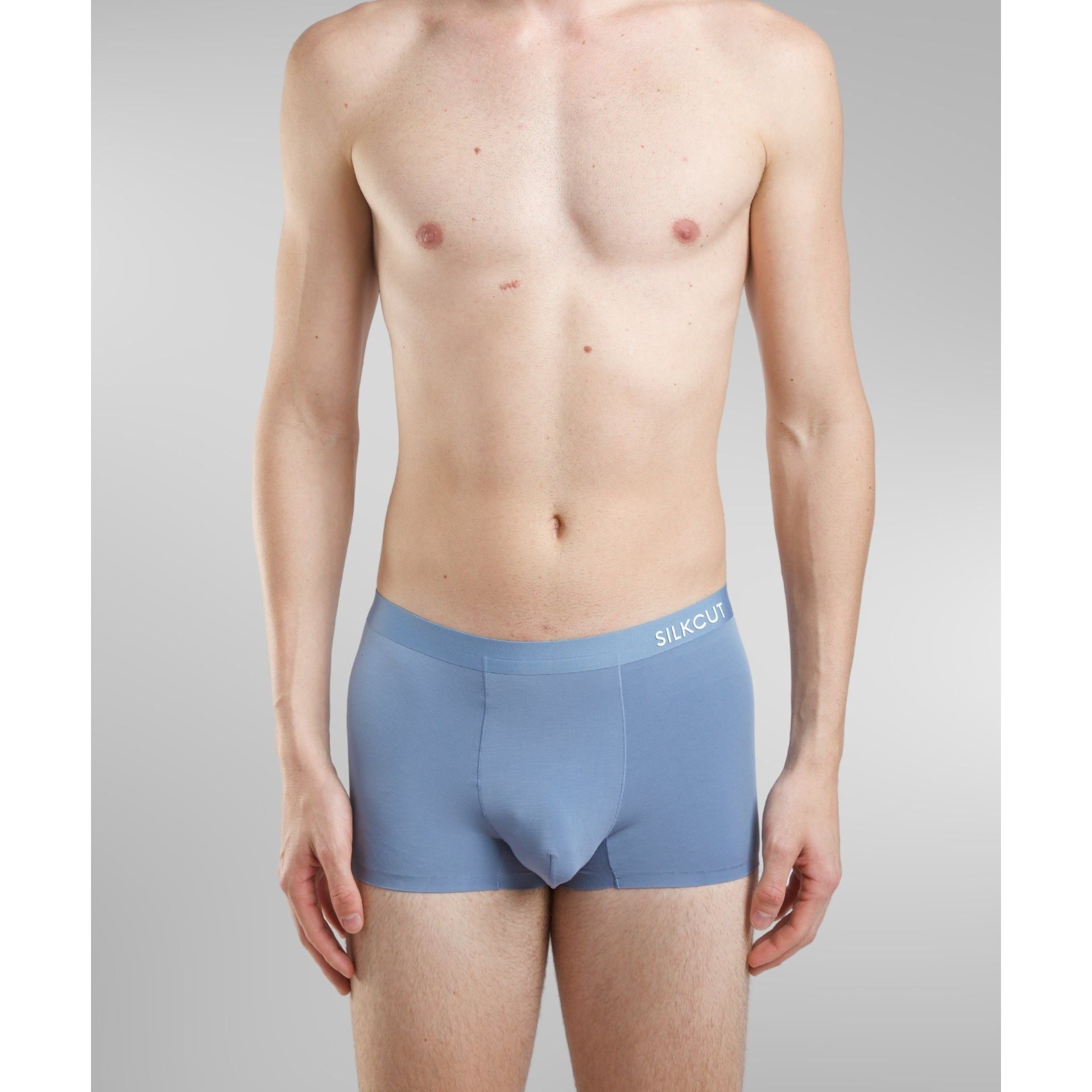 man in blue trunk underwear