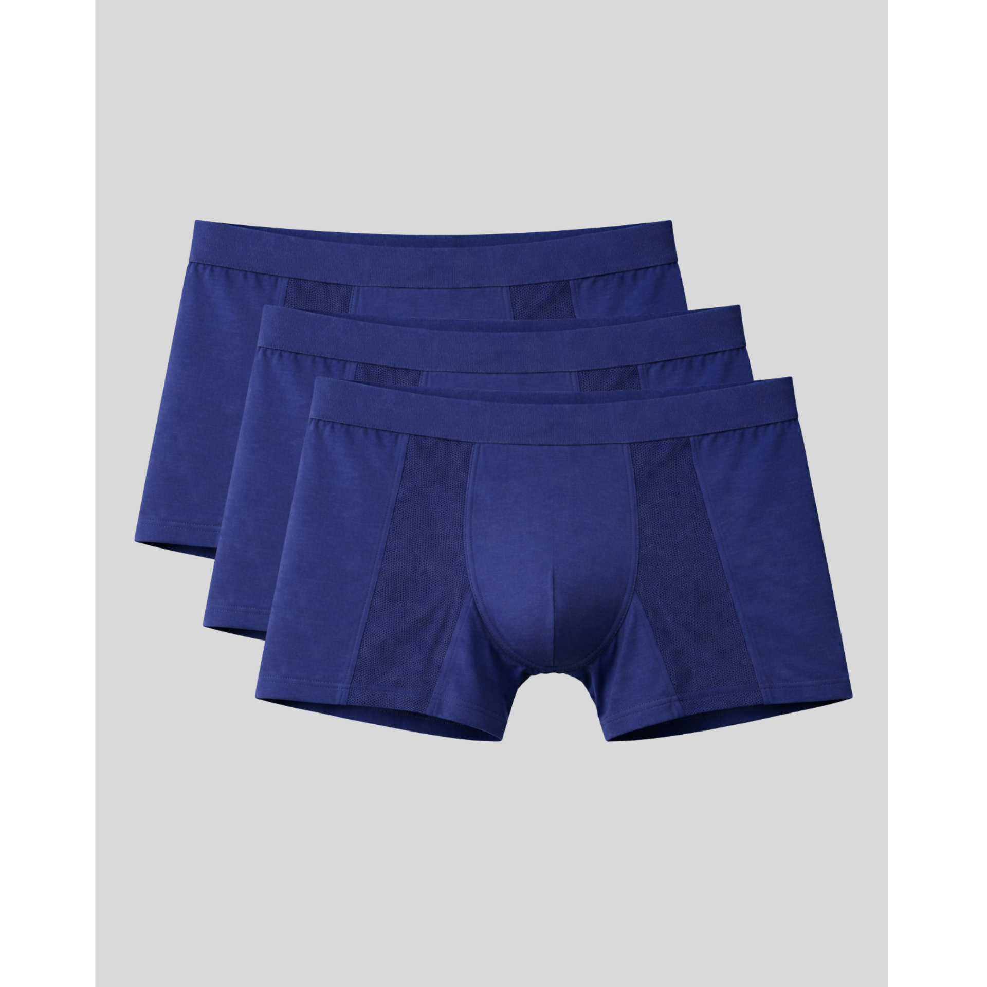 Three pairs of blue boxer briefs on a light gray background