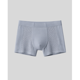 Gray boxer briefs with mesh panels on a light gray background