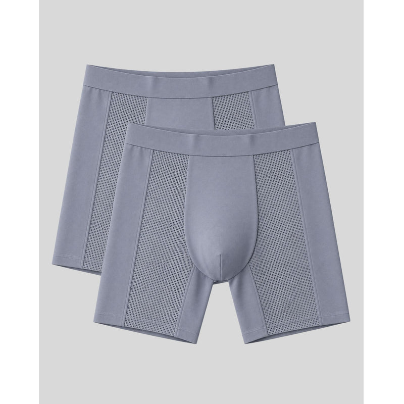 Two pairs of men's boxer briefs in a muted grayish blue, displayed in a layered stack against a light gray background.