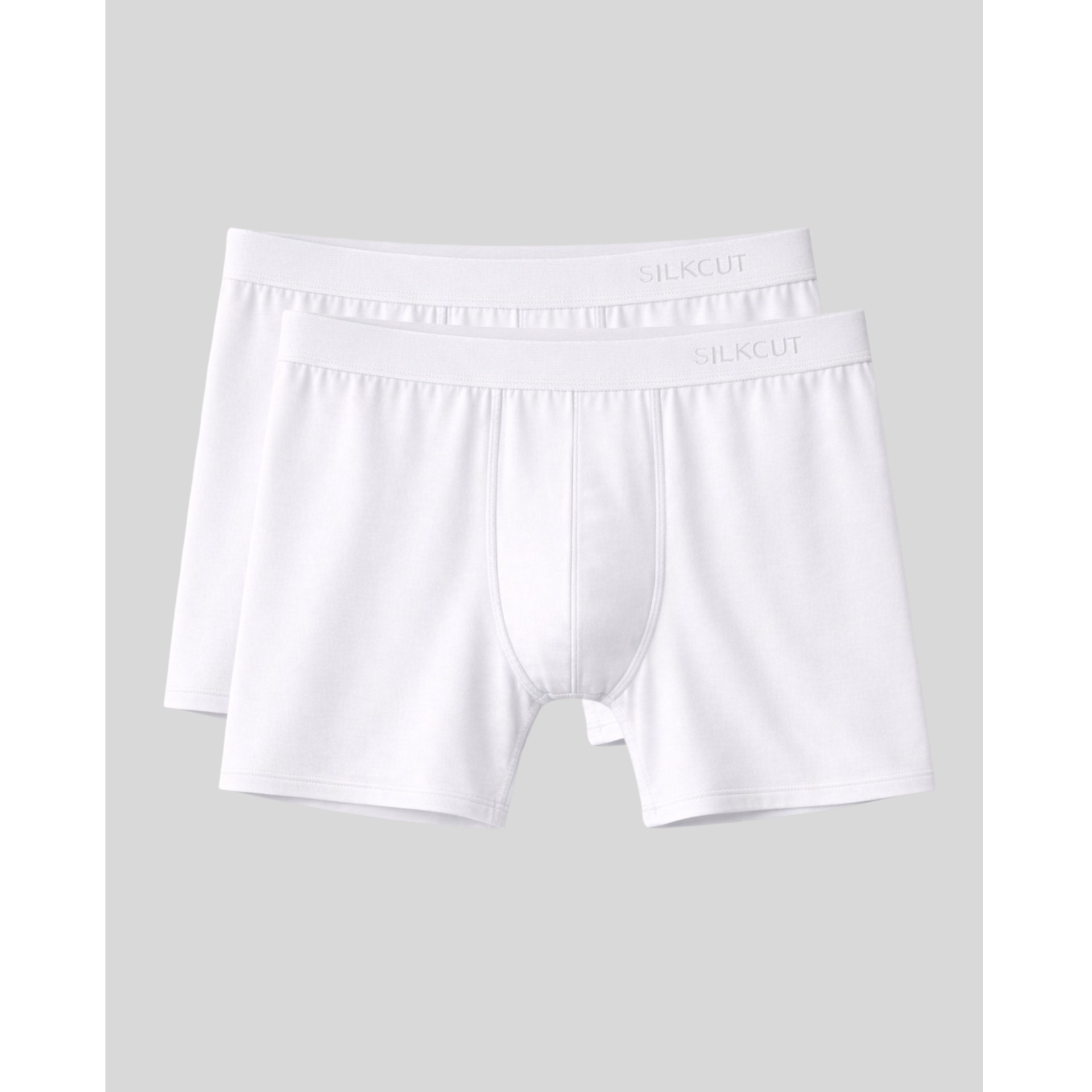Two pairs of white boxer briefs on a light gray background