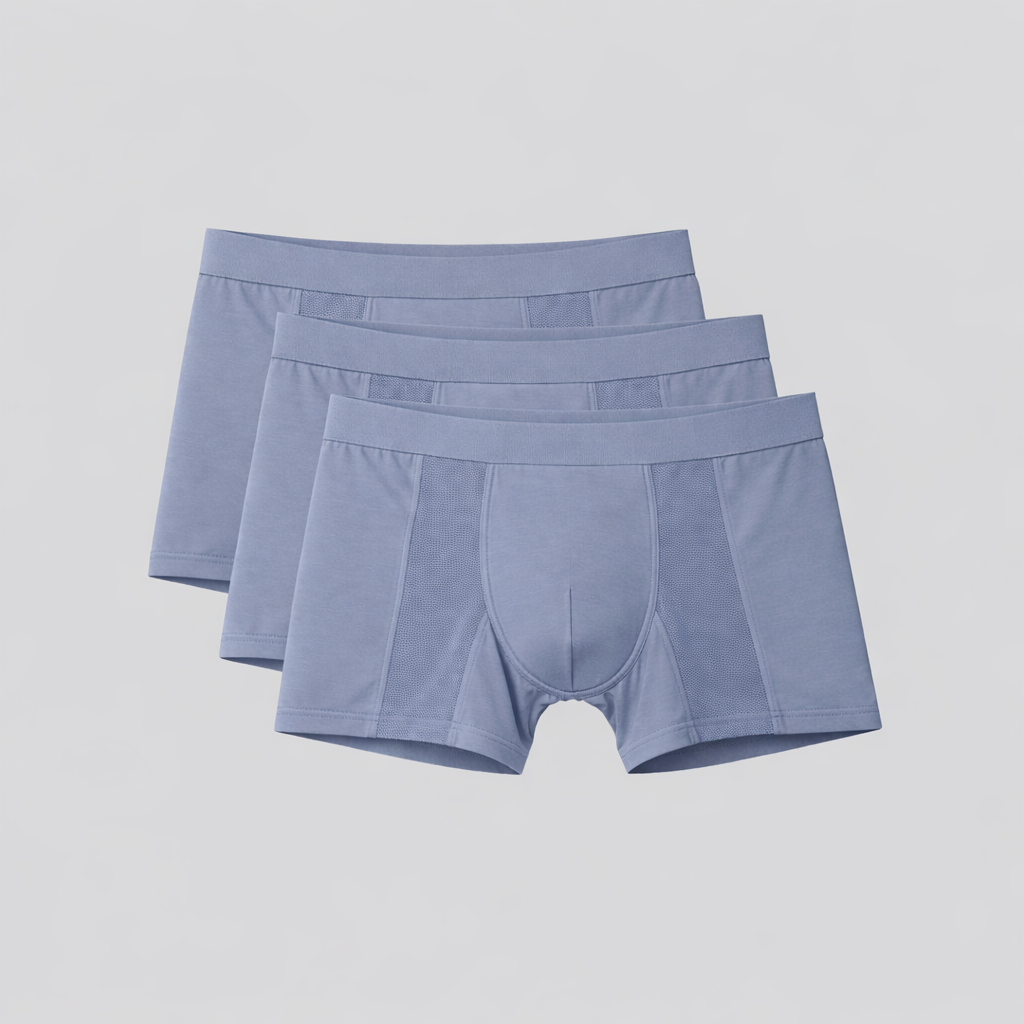 Three pairs of light blue boxer briefs on a light gray background