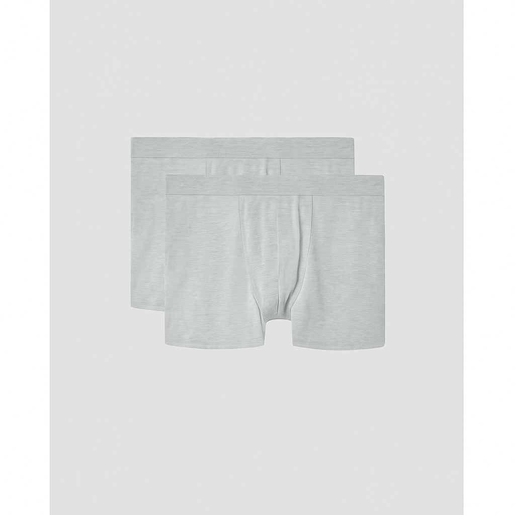 Two pairs of gray boxer briefs on a light gray background