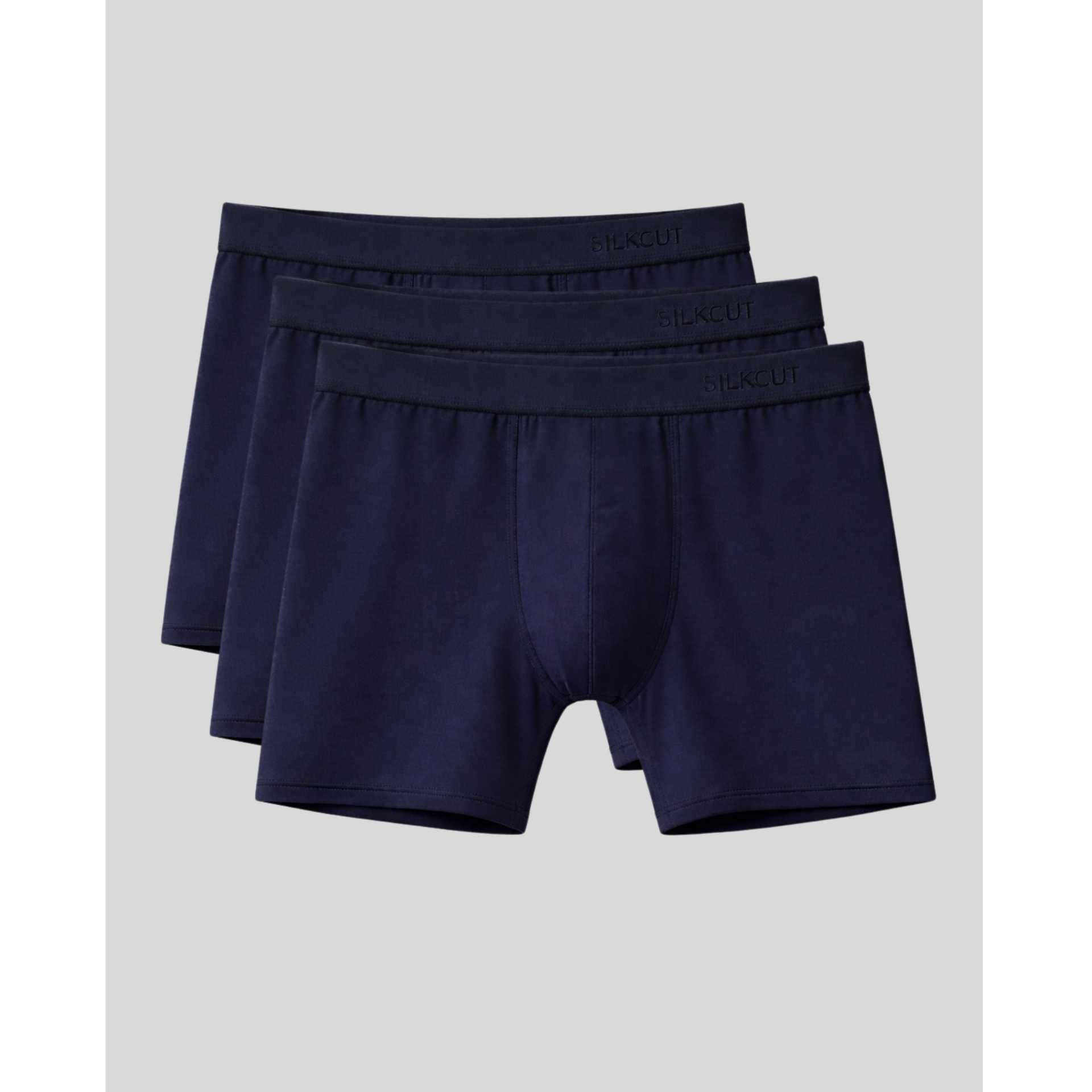 Three pairs of navy blue boxer briefs for men on a light gray background
