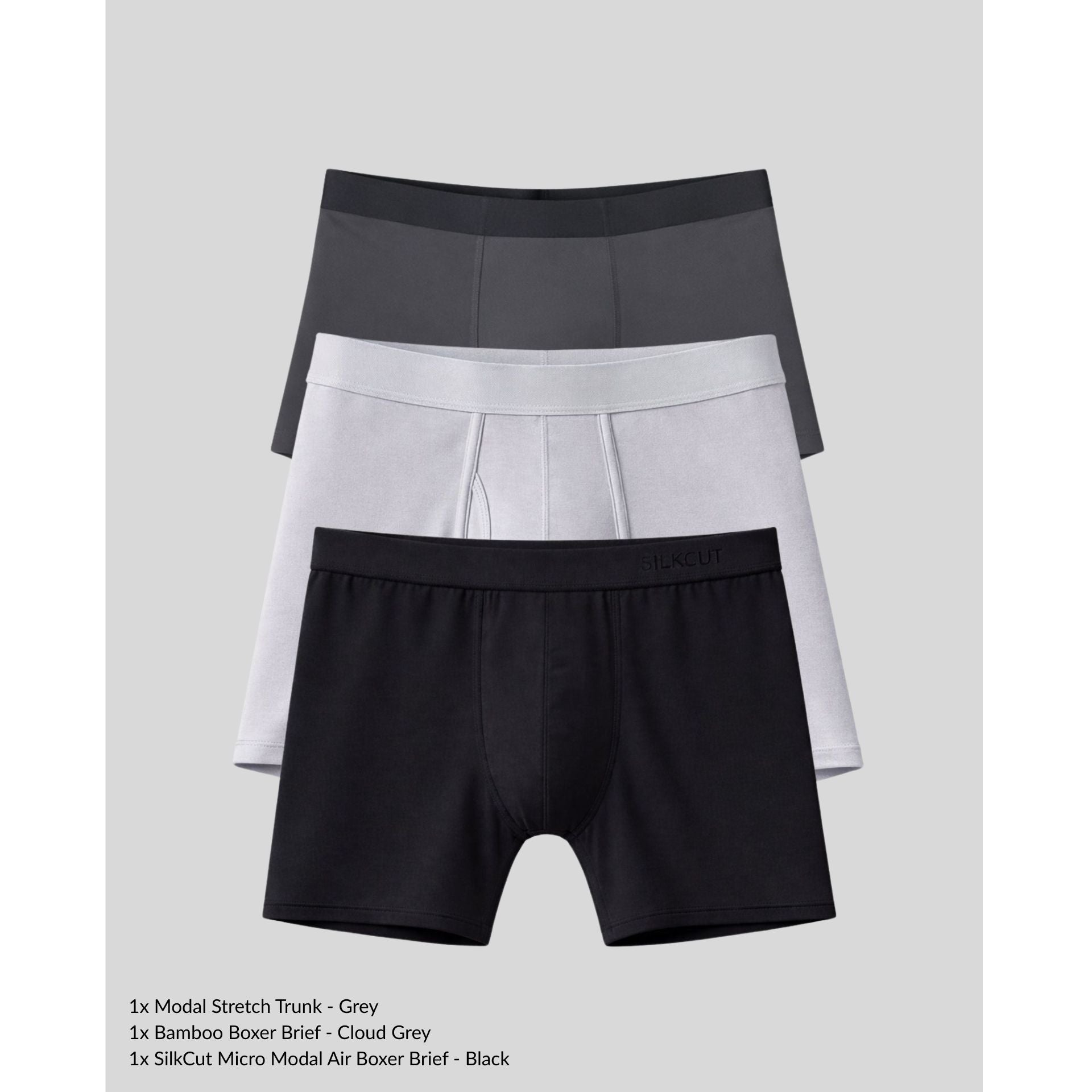 Three pairs of men's underwear in black, gray, and cloud gray on a light gray background.