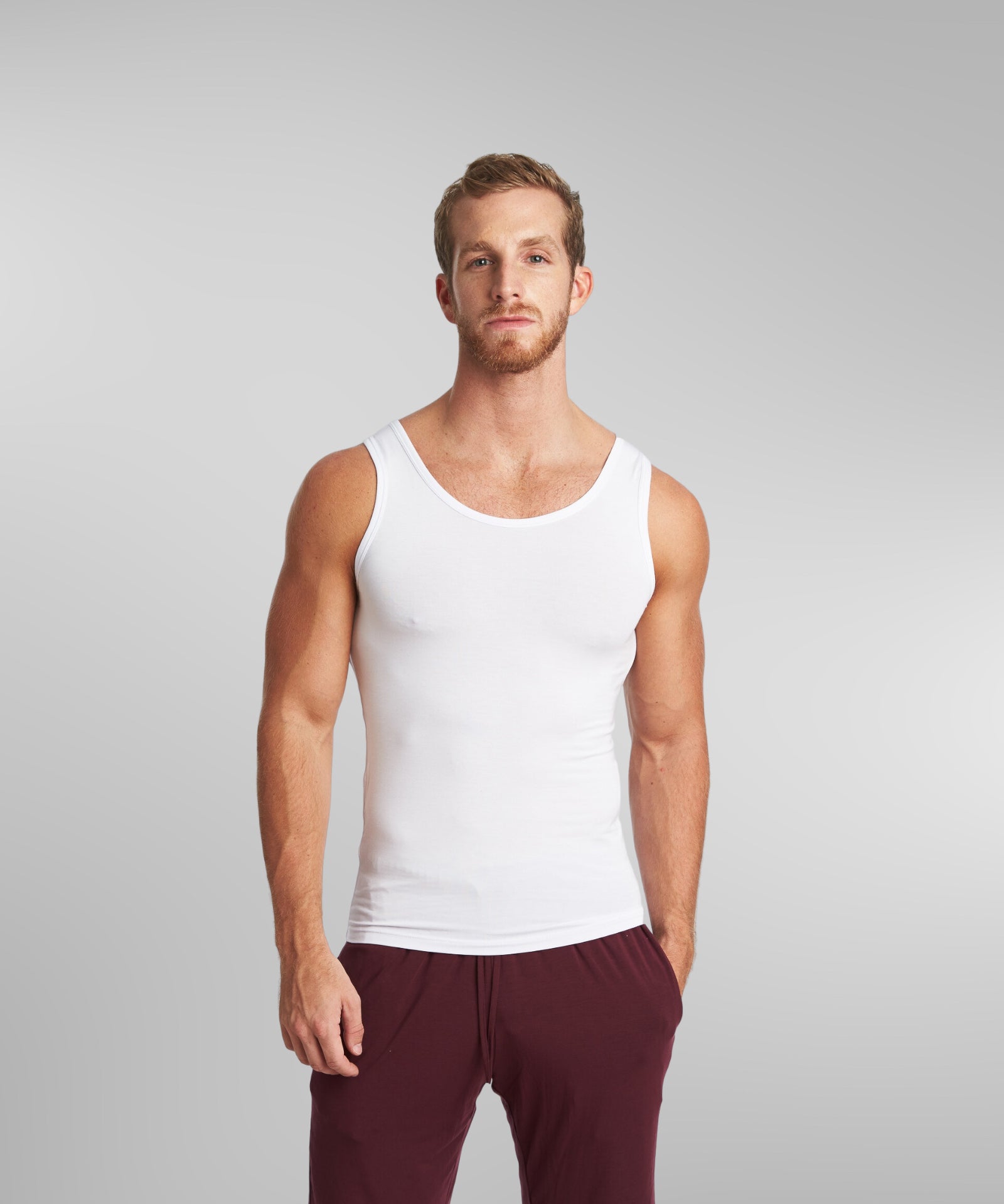 mean wearing a round neck white tank top