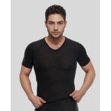 Man wearing a black t-shirt against a plain background