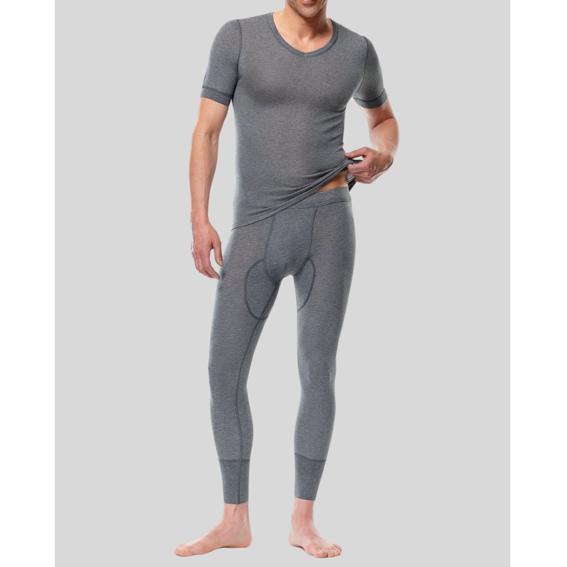 Man wearing gray thermal underwear on a plain background