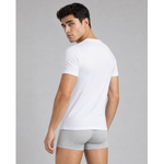 Male model wearing a white silkcut underwear  micro modal air men’s V-neck undershirt and grey boxer briefs in a front studio pose.
