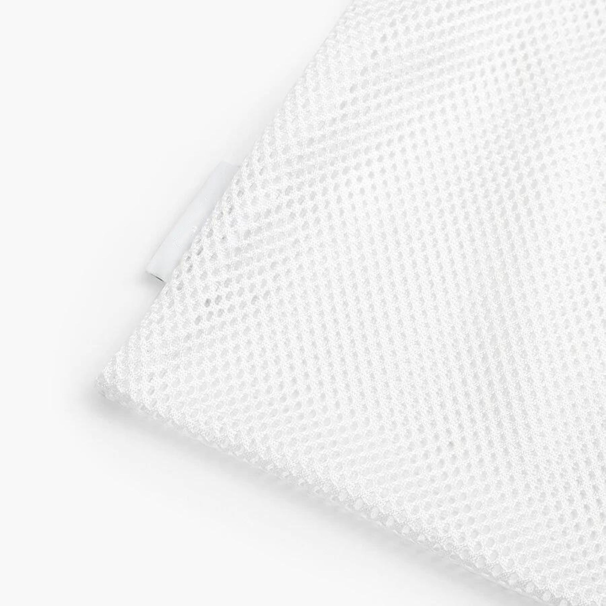 An image of a white mesh washing bag in white background